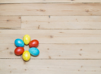 Fototapeta na wymiar easter eggs on wood background
