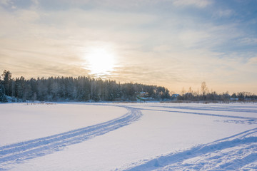 Fototapeta na wymiar Winter evening on snow-covered river.