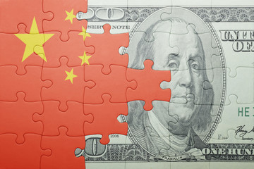 puzzle with the national flag of china and dollar banknote