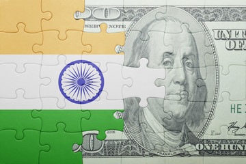 puzzle with the national flag of india and dollar banknote