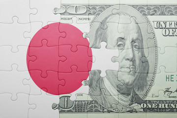 puzzle with the national flag of japan and dollar banknote