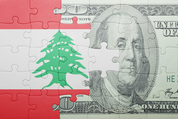 puzzle with the national flag of lebanon and dollar banknote