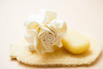 Fototapeta na wymiar Closeup body sponge soap and scrub glove