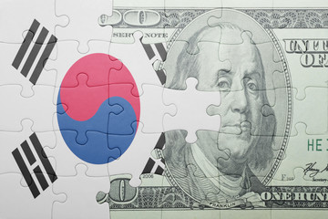 puzzle with the national flag of south korea and dollar banknote