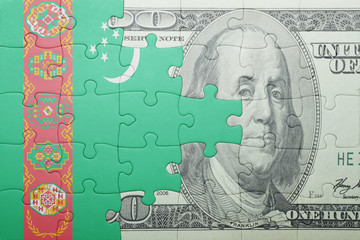 puzzle with the national flag of turkmenistan and dollar banknote