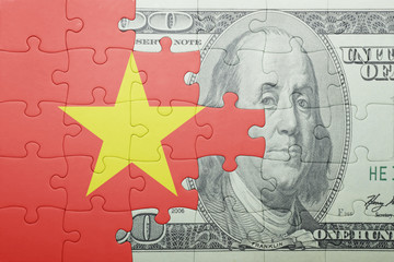 puzzle with the national flag of vietnam and dollar banknote