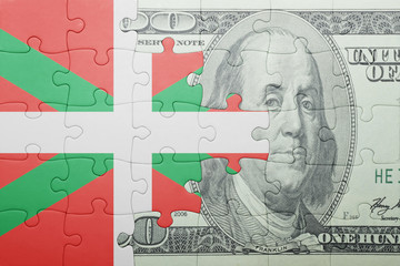 puzzle with the national flag of basque country and dollar banknote