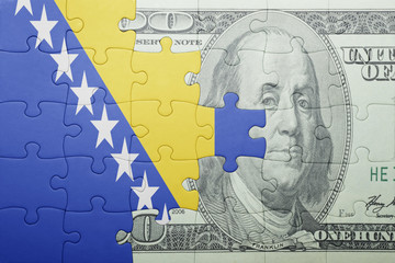 puzzle with the national flag of bosnia and herzegovina and dollar banknote