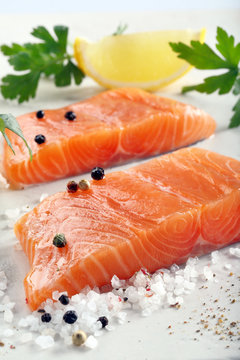 Fresh raw salmon fillet and aromatic spices for baking