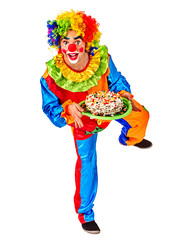 Portrait of happy birthday clown holding bunch of colour balloons.  Isolated.