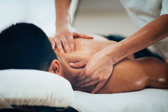 Sports massage. Therapist massaging shoulders