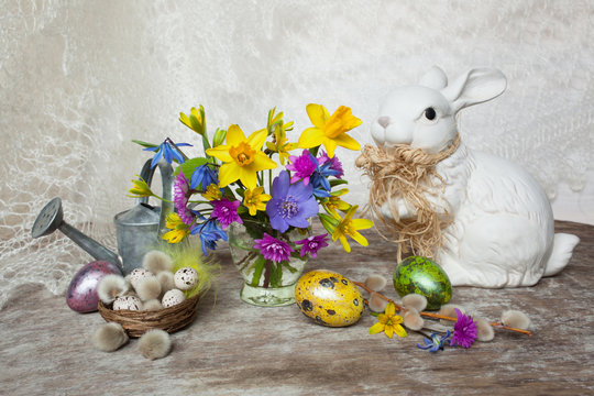 Easter, spring flowers, colored eggs and bunny