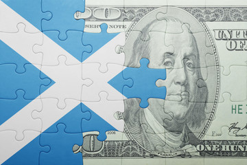 puzzle with the national flag of scotland and dollar banknote