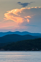 Fototapeta na wymiar Sunlight reflected on clouds after sunset, west coast of Sithonia, Greece