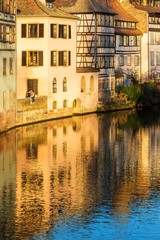 Fototapeta na wymiar Strasbourg, water canal in Petite France area. Half timbered hou