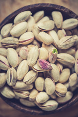 Pistachios in wooden bowl