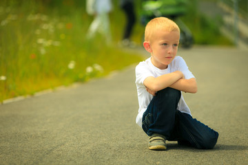  Little thoughtful boy child portrait outdoor