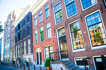 Traditional dutch buildings and blocks of flats in in old Amsterdam, Netherlands