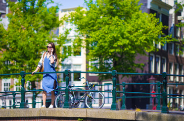 Obraz premium Young caucasian girl enjoy european vacation in Amsterdam, Holland