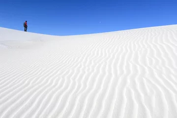 Meubelstickers Photographer walking on white sand dunes, White Sands National Monument, New Mexico © sumikophoto