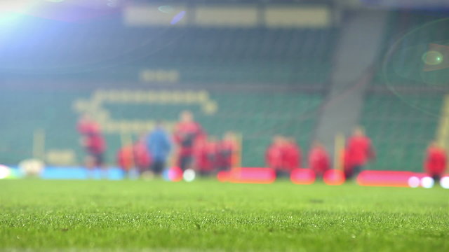 Blurred footage of a football team warming up before a match