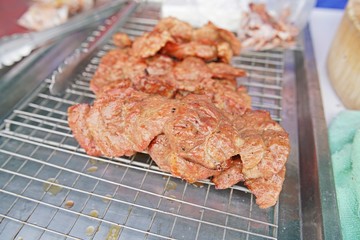 Grilled pork ribs on steel tray - delicious toasted traces - thai style