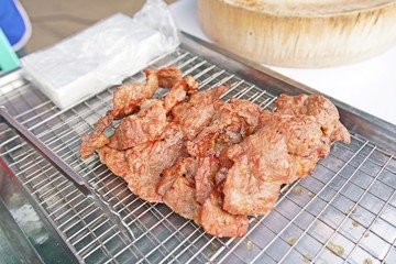 Grilled pork ribs on steel tray - delicious toasted traces - thai style