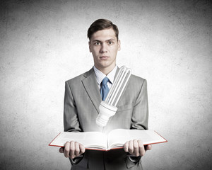 Businessman with book in hands