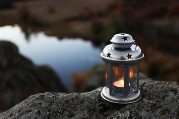 Decorative lamp on rock in mountains