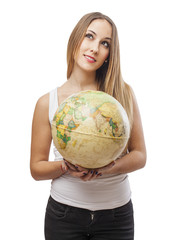 Fototapeta premium beautiful young woman holding a globe