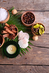 Beautiful spa setting on palm leaf on wooden table