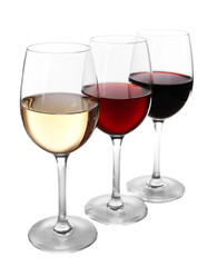 Different kinds of wine in gasses on light background