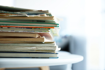 Pile of old books on white table
