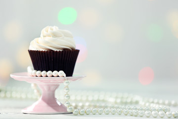 Chocolate cupcake on blurred background