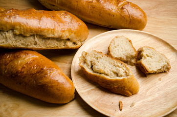 Fresh bread on wooden background