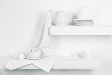 Tableware with napkins on a white background