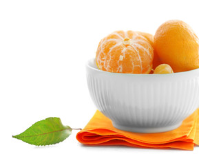 Tangerines in bowl on white wooden table, close up