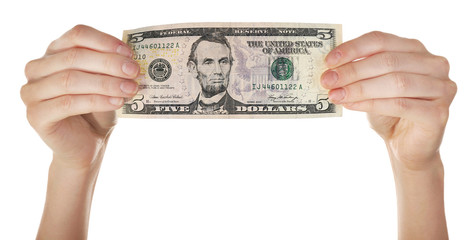 Hands holding five dollar banknote, isolated on white
