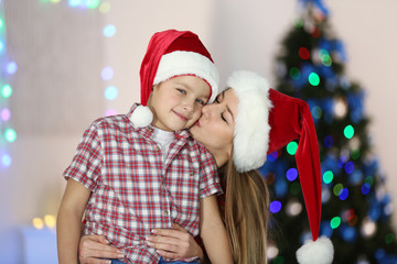 Portrait of girl and boy in decorated Christmas room