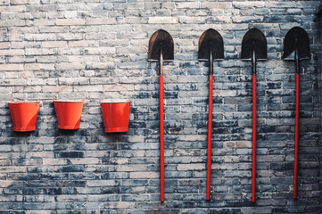 Three fire buckets and shovels