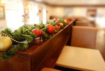 Christmas decorations on wooden desk in cafe