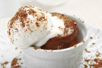 Chocolate lava cake with ice-cream on the table, close-up