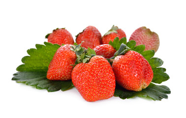 pile of strawberry on leaves with white background