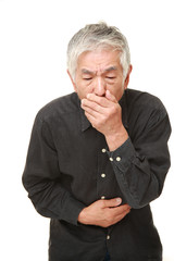 senior Japanese man feels like vomiting