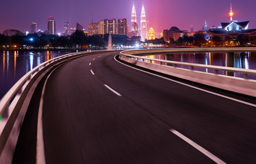 Highway overpass motion blur with city background .night scene