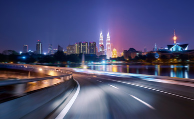 Fototapeta na wymiar Highway overpass motion blur with city background .night scene