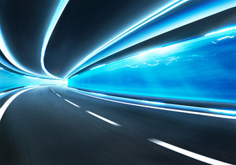Abstract blurred speed motion road in glass tunnel underwater