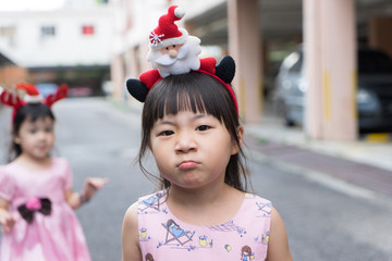 Two cute little girl wearing a tiara Christmas