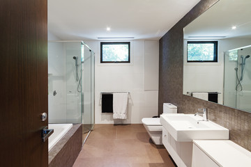 Fototapeta na wymiar Contemporary brown natural tones family bathroom