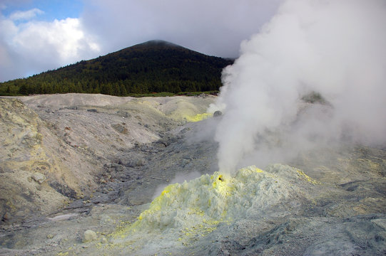 Fumarole surge of the gas and sulphurs on vulcan of the Mendeleev. Kurily,island Kunashir